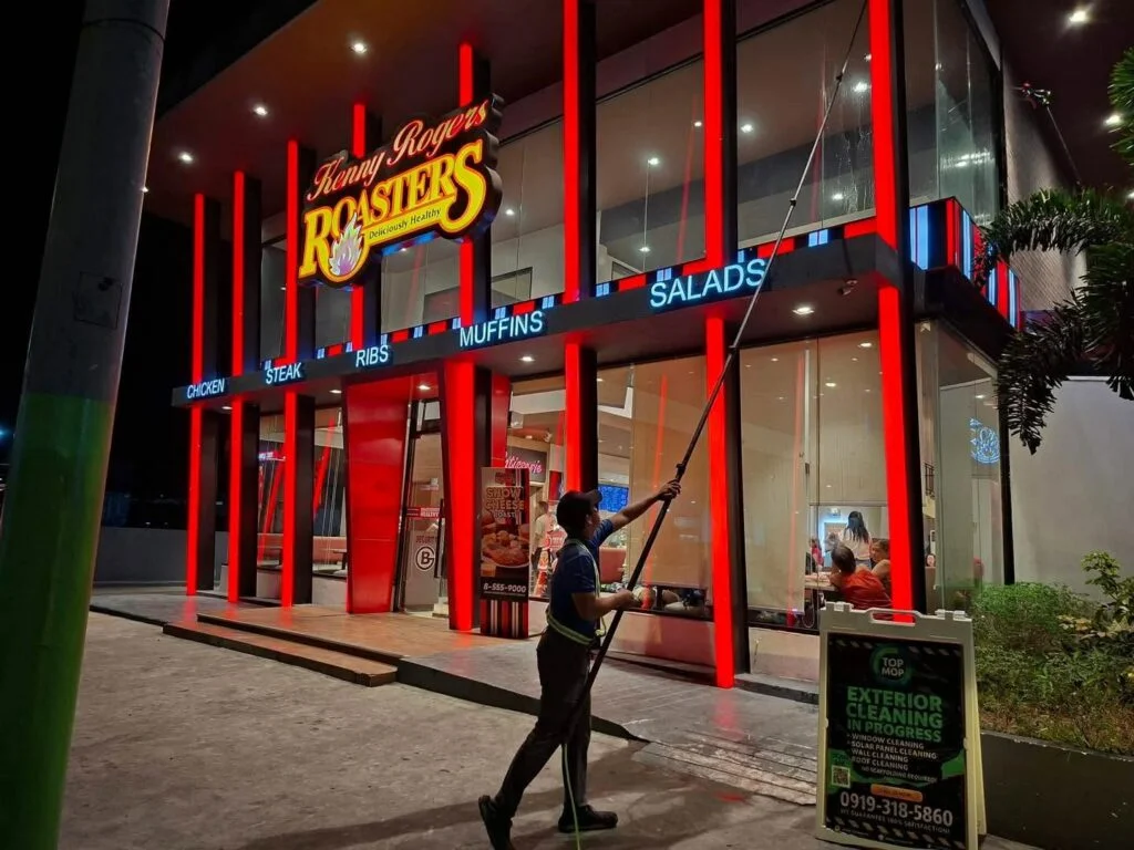 TopMop crew cleaning exterior glass at Kenny Rogers Roasters